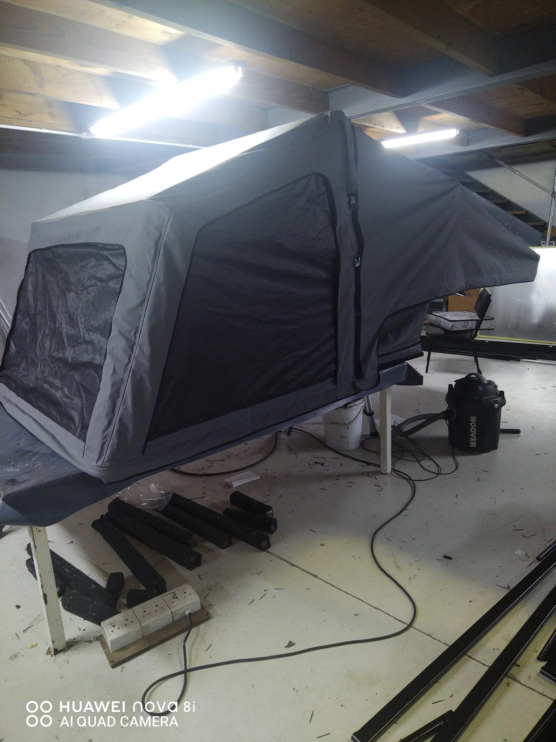 Camping tent repair sewing workshop with fabric and tools